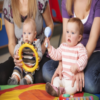 Moms with babies playing instruments