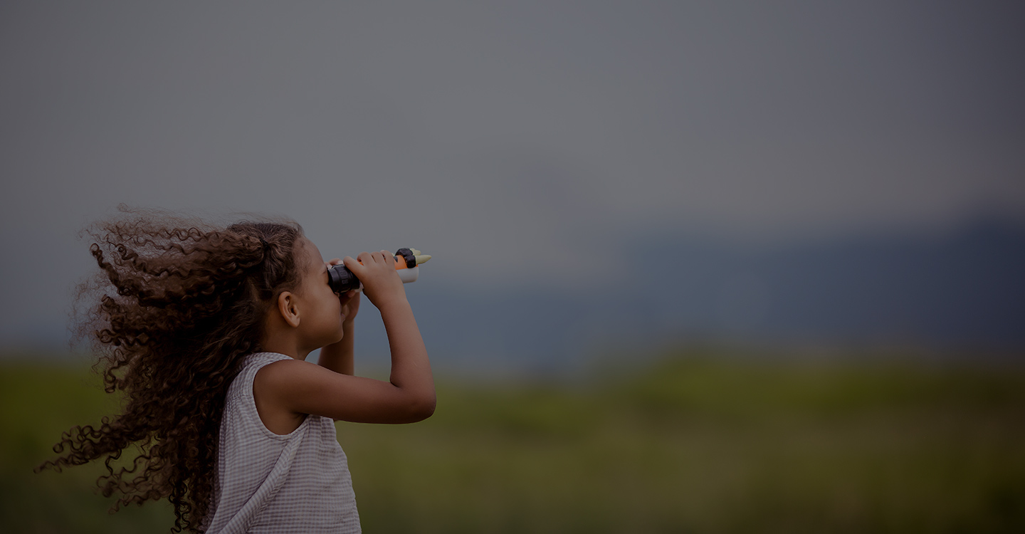 Florida girl looking into binoculars