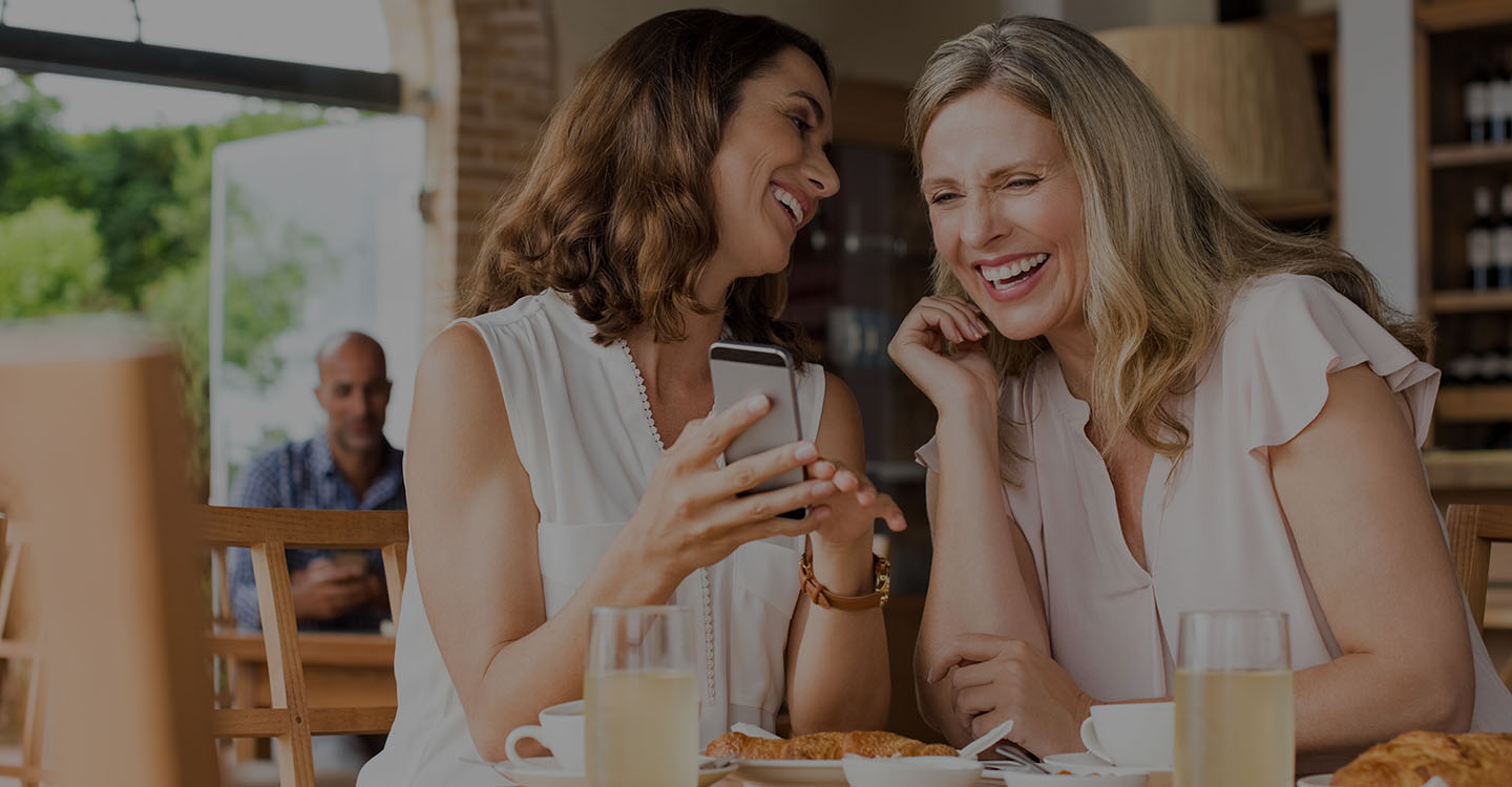 Women having lunch together and laughing