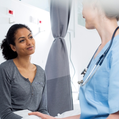 Female patient consulting a physician about her upcoming surgery
