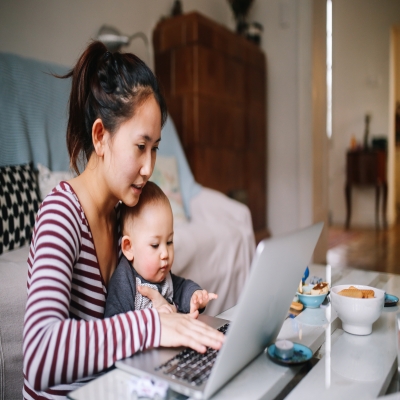 Mom with baby on computer